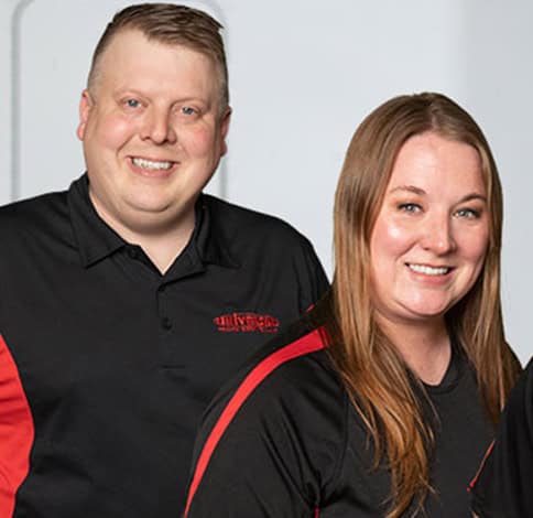 Universal Truck Service employees in company uniforms at UTS heavy duty truck and trailer shop in Roseville MN